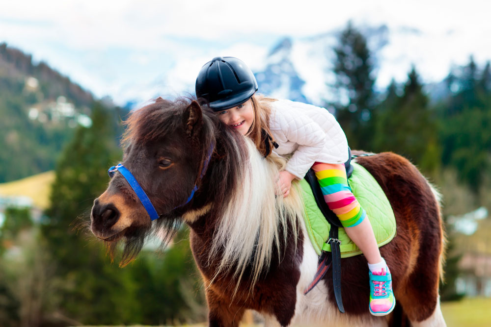 girl riding a pony