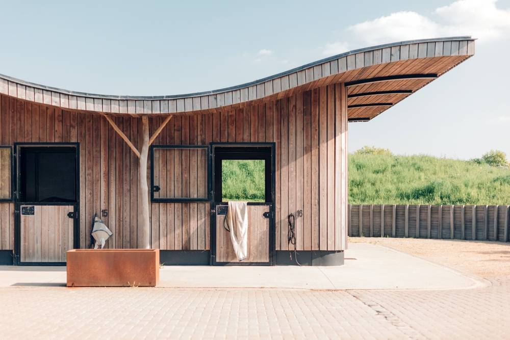 horse barn with wavy roof