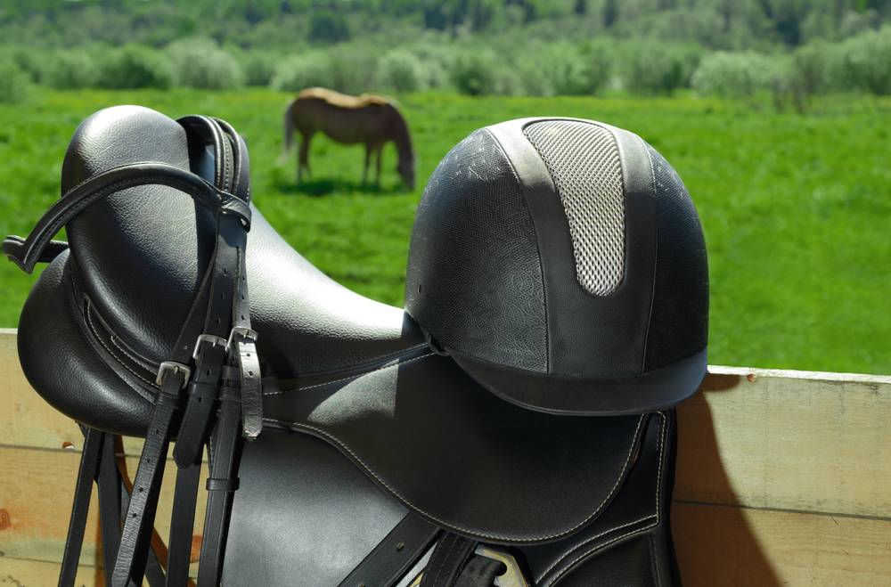 horse saddle and english riding helmet