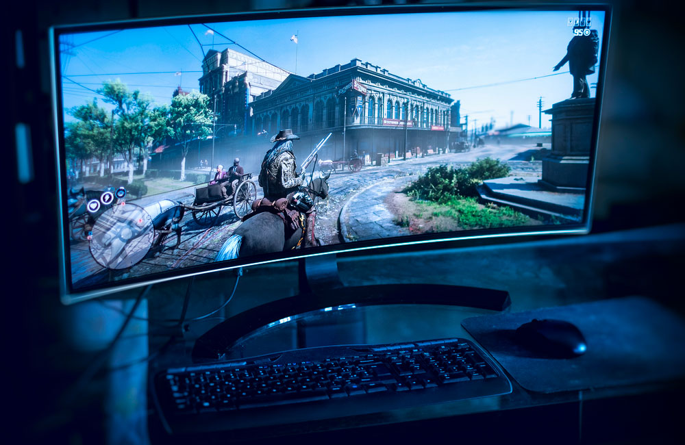 monitor with rdr2 game on screen