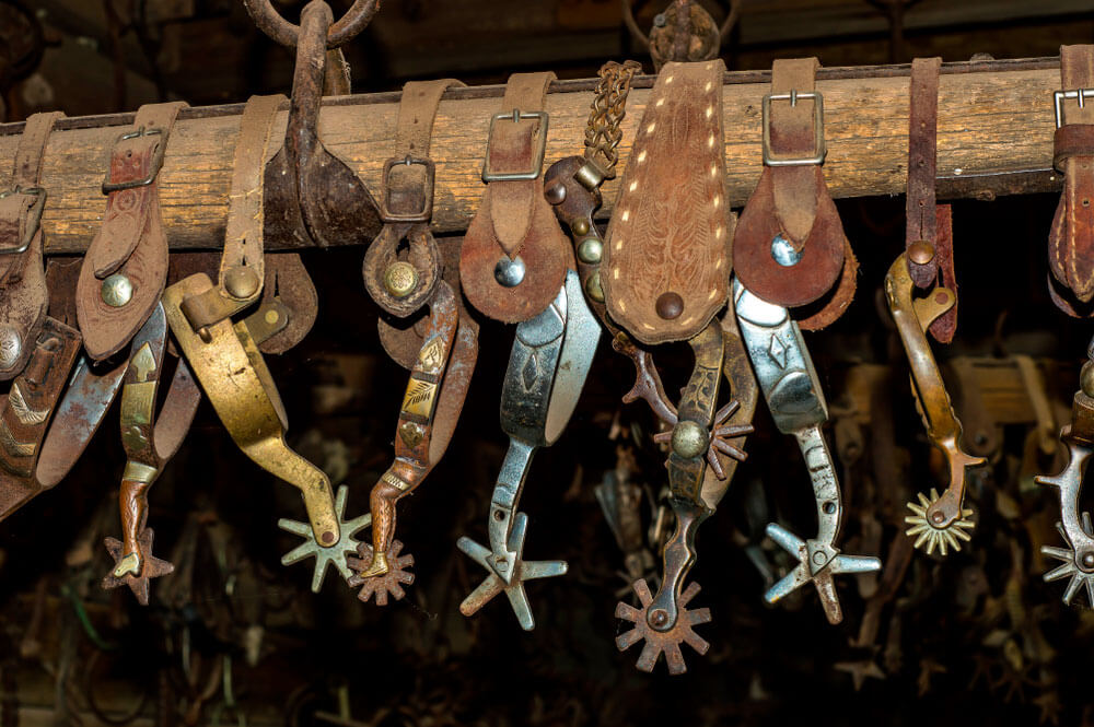 riding spurs and hanging on the wooden pole