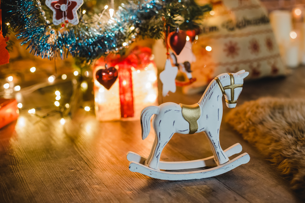 rocking horse under christmas tree