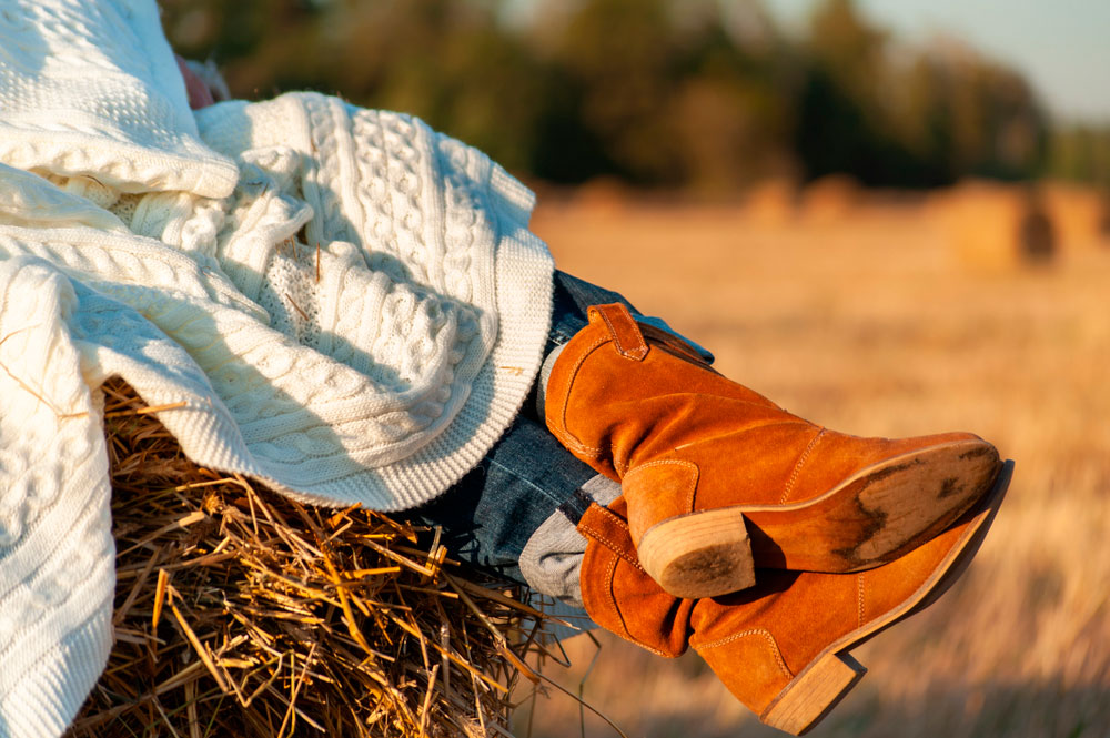 woman in suede cowboy boots